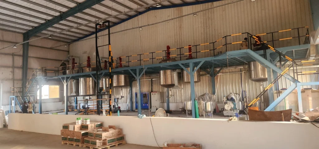 Steel Tech Engineering mezzanine walkway with multiple mixing vessels and safety railings