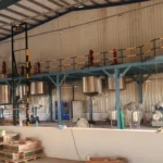 Steel Tech Engineering mezzanine walkway with multiple mixing vessels and safety railings