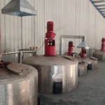 Steel Tech Engineering wide view of processing plant showing tanks, staircases, and conveyors
